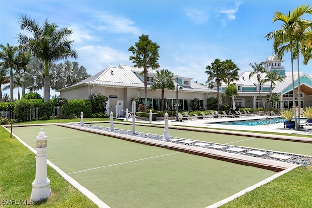 surrounding community featuring fence and a lawn