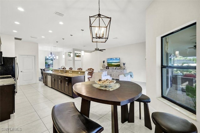 dining room featuring ceiling fan with notable chandelier, light tile patterned floors, visible vents, and recessed lighting