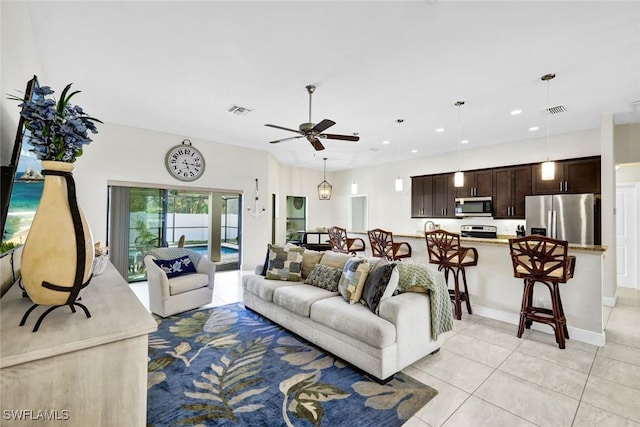 living area with ceiling fan, light tile patterned flooring, visible vents, and recessed lighting