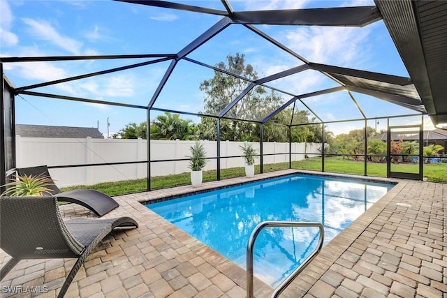 view of swimming pool featuring a lanai, a patio area, a fenced backyard, and a fenced in pool