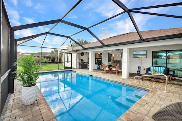 outdoor pool featuring a lanai and a patio