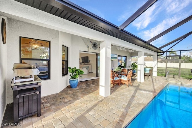 view of swimming pool featuring a fenced in pool, a lanai, a patio area, and fence