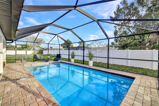 view of swimming pool with a fenced in pool, a fenced backyard, and a patio