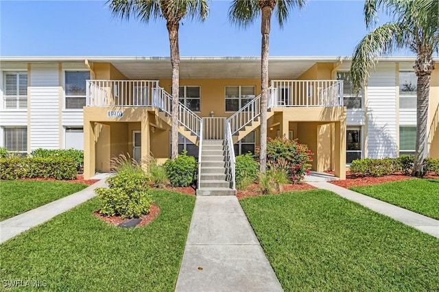 view of property featuring stairway