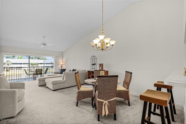 dining room with light carpet, high vaulted ceiling, ceiling fan with notable chandelier, and baseboards