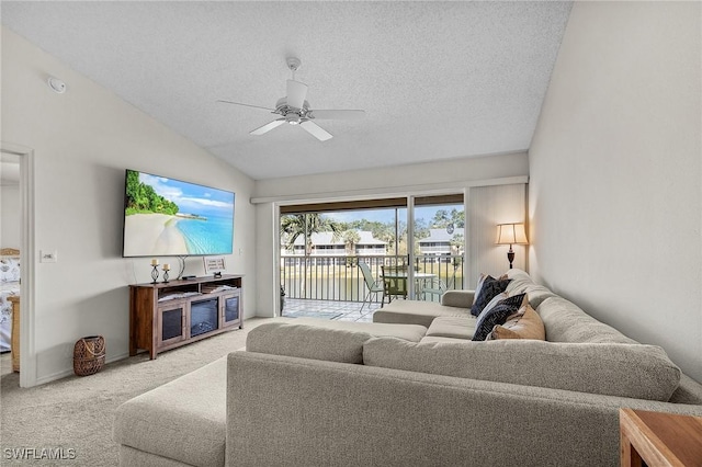 living area featuring baseboards, light colored carpet, ceiling fan, vaulted ceiling, and a textured ceiling