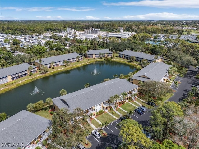 birds eye view of property featuring a water view and a residential view