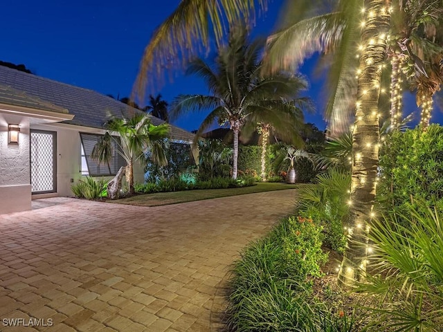 view of yard at twilight