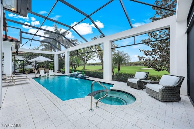 view of swimming pool featuring glass enclosure, a pool with connected hot tub, and a patio area