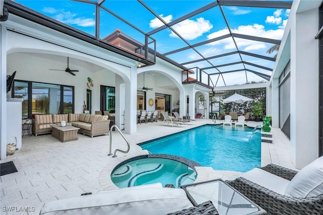 view of swimming pool featuring an outdoor living space, a pool with connected hot tub, ceiling fan, a lanai, and a patio area