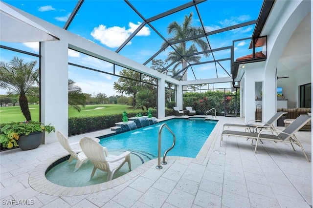 outdoor pool with a lanai and a patio