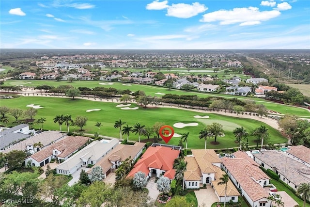 birds eye view of property featuring a residential view and view of golf course