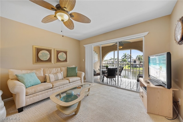 living room with light carpet and ceiling fan