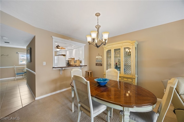 dining room with light tile patterned flooring, light carpet, baseboards, and ceiling fan with notable chandelier