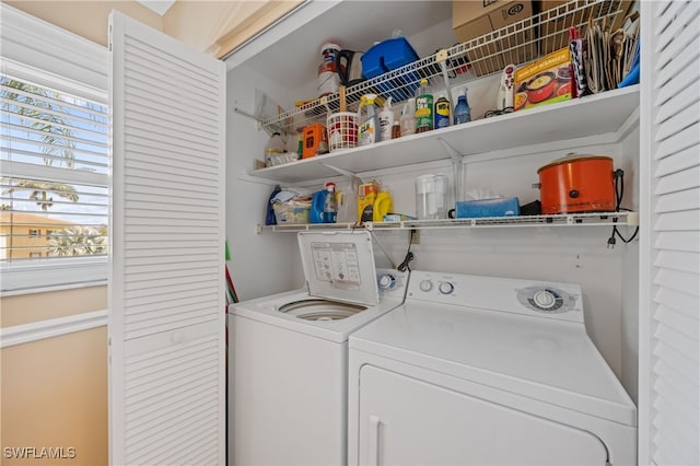 laundry area with laundry area and washer and clothes dryer