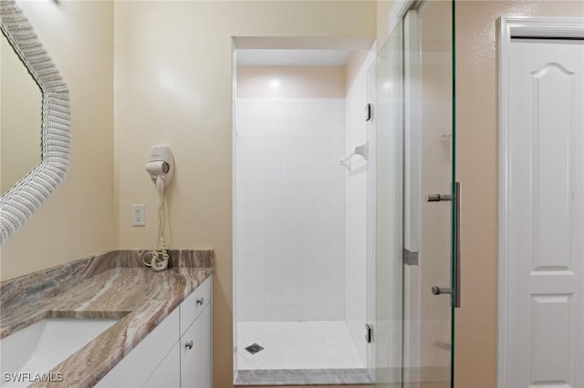 full bath featuring a shower stall and vanity