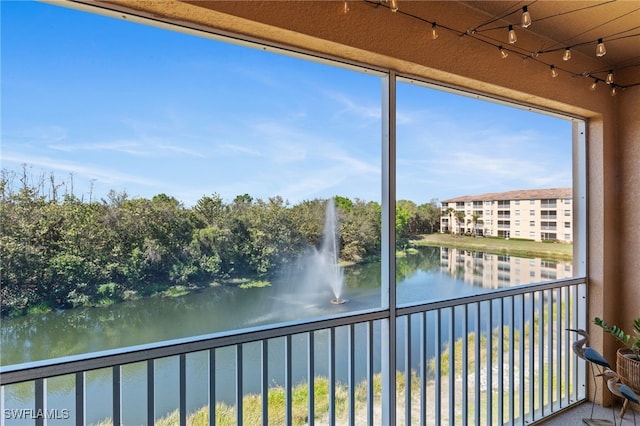 balcony featuring a water view