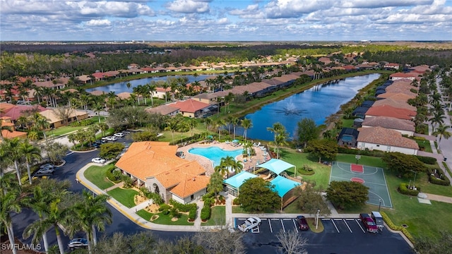 aerial view with a water view and a residential view