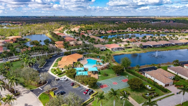 bird's eye view featuring a water view and a residential view