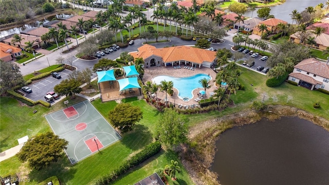 bird's eye view with a residential view and a water view