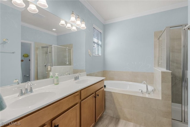 bathroom with a stall shower, crown molding, and a sink