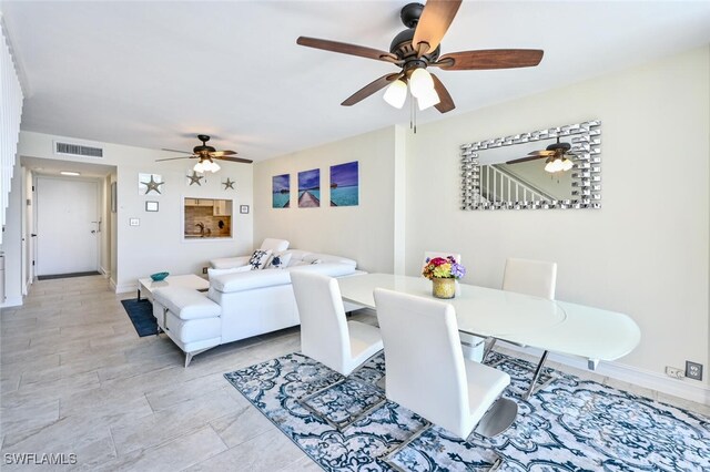 5 Bluebill Ave Unit 511, Naples, FL 34108 - dining space featuring a ceiling fan and baseboards