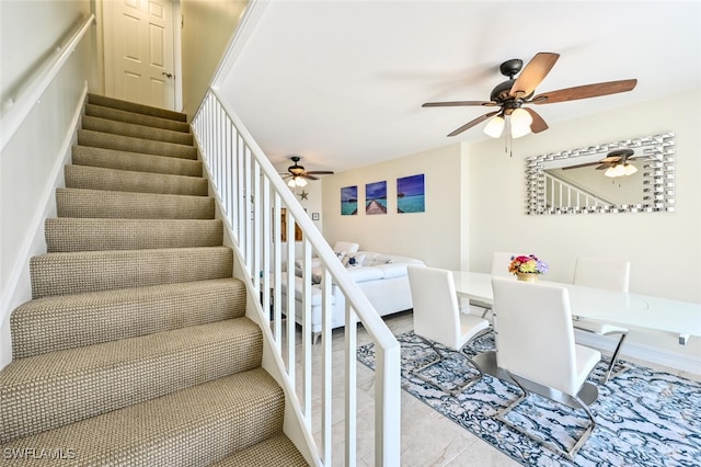 stairway with tile patterned floors