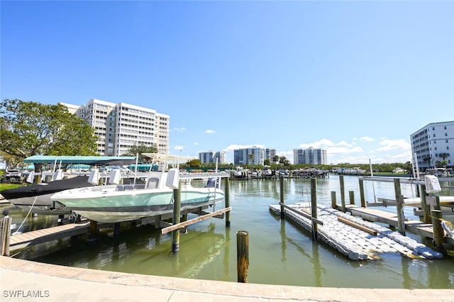 5 Bluebill Ave Unit 511, Naples, FL 34108 - dock featuring boat lift, a water view, and a city view