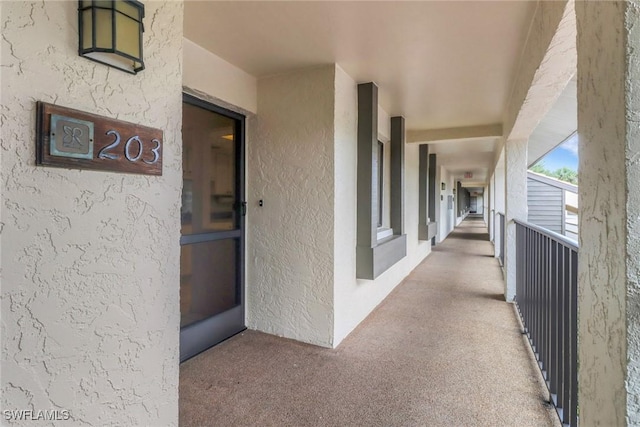 view of exterior entry with stucco siding