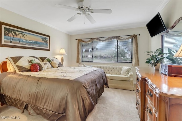 bedroom with light carpet, multiple windows, and a ceiling fan