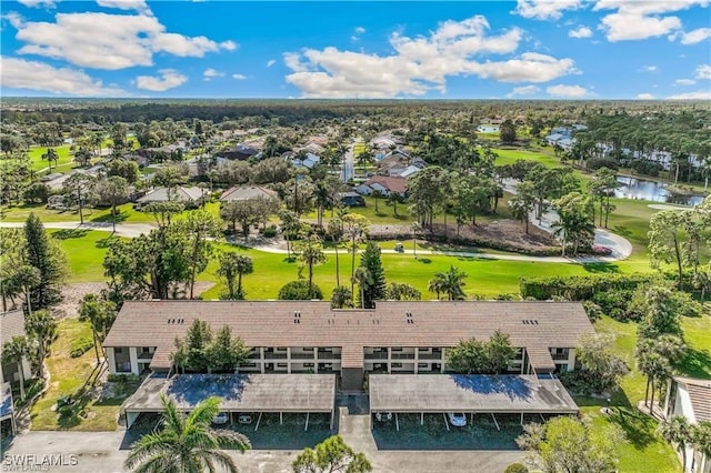 bird's eye view with a water view and golf course view