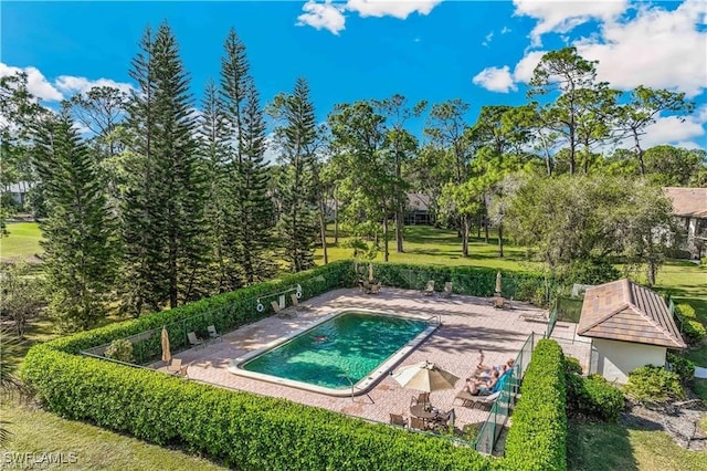 pool featuring a patio and fence