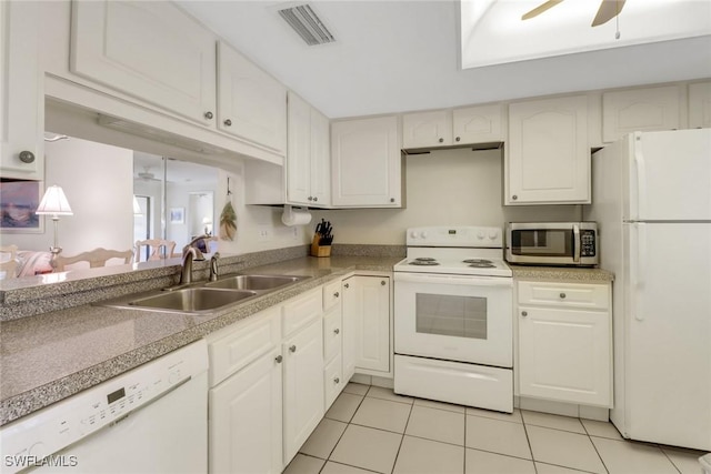 kitchen featuring light tile patterned floors, visible vents, ceiling fan, a sink, and white appliances