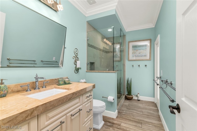 1015 Goldenrod Ave, Marco Island, FL 34145 - bathroom featuring toilet, ornamental molding, vanity, a shower stall, and wood finish floors
