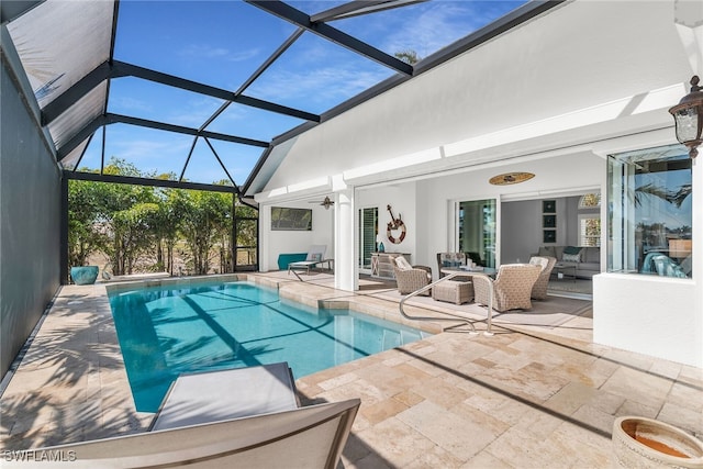 1015 Goldenrod Ave, Marco Island, FL 34145 - outdoor pool with a patio area, glass enclosure, outdoor lounge area, and a ceiling fan