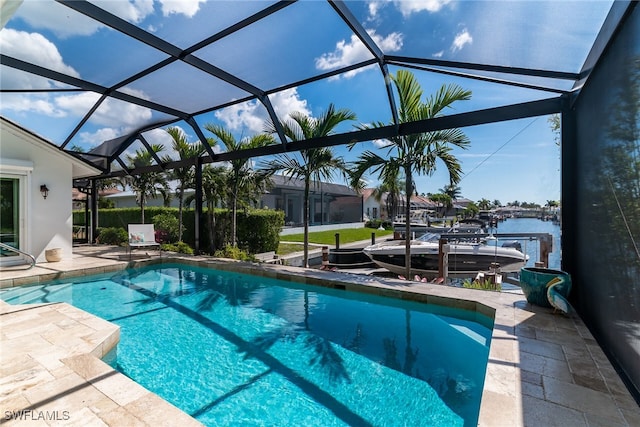 1015 Goldenrod Ave, Marco Island, FL 34145 - outdoor pool featuring a lanai, a patio, and a boat dock