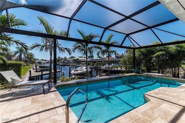 1015 Goldenrod Ave, Marco Island, FL 34145 - pool with a dock, a patio area, glass enclosure, and a water view