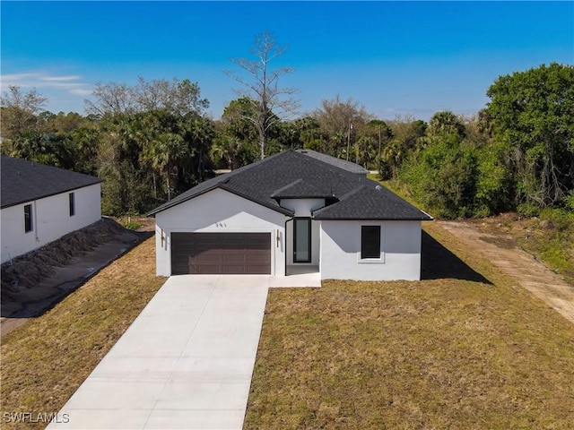 single story home with roof with shingles, stucco siding, concrete driveway, an attached garage, and a front lawn