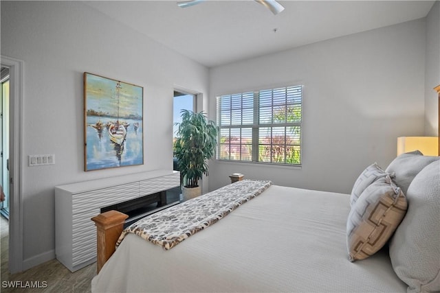 bedroom featuring ceiling fan and baseboards