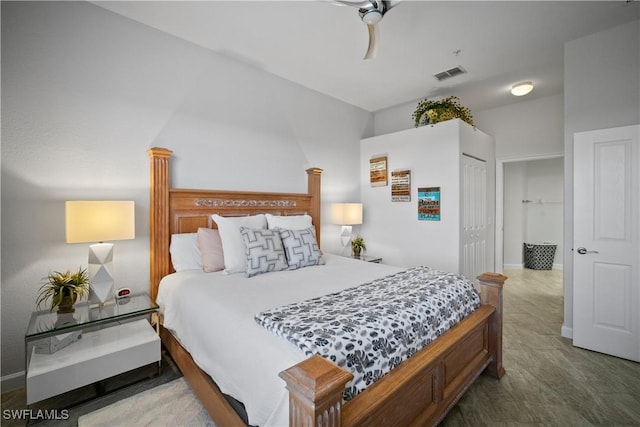 bedroom with a closet, visible vents, and ceiling fan