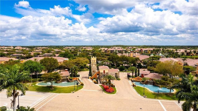 drone / aerial view with a water view and a residential view