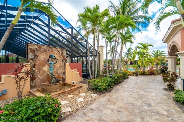 view of patio with a lanai