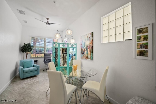 dining room featuring visible vents, ceiling fan, and baseboards