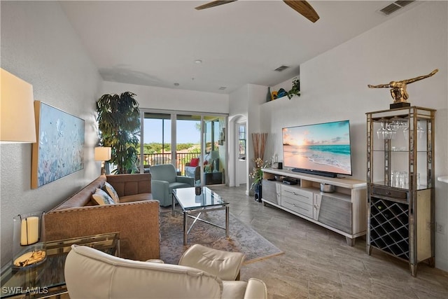 living room with visible vents and ceiling fan