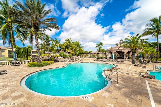 community pool featuring a patio area