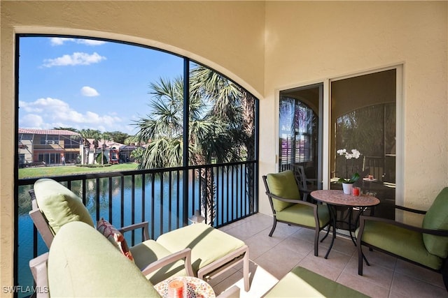 sunroom with a water view