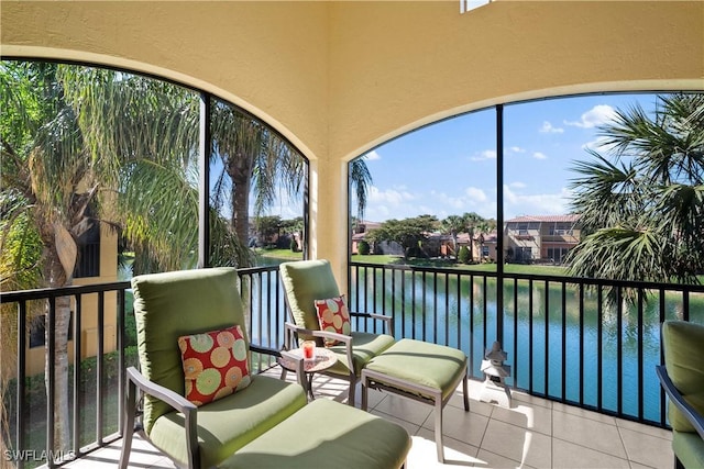 sunroom / solarium with a water view