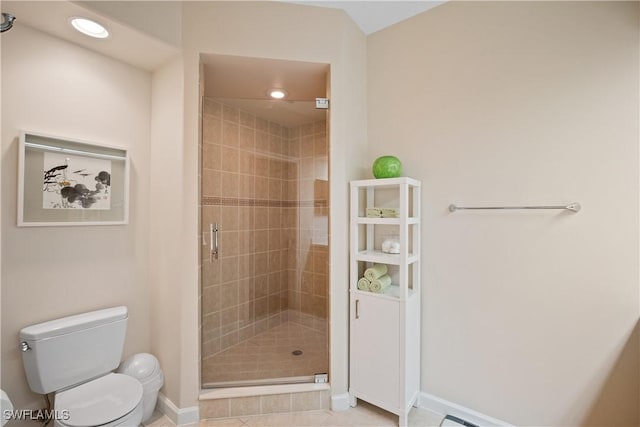 full bath with toilet, recessed lighting, baseboards, a shower stall, and tile patterned floors