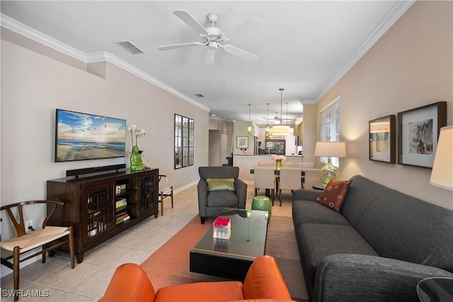 living area with a ceiling fan, light tile patterned flooring, visible vents, and crown molding