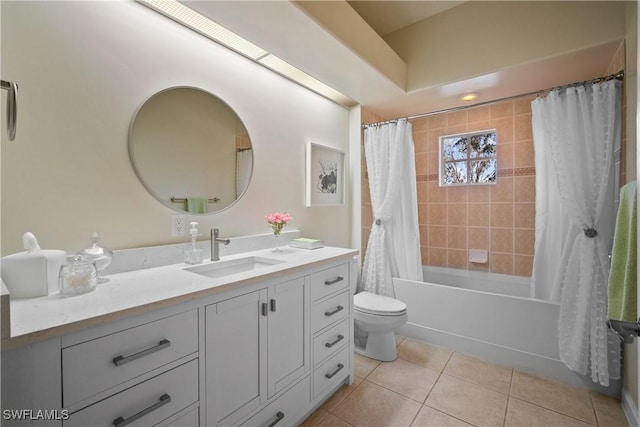 full bath featuring toilet, tile patterned flooring, shower / bath combination with curtain, and vanity